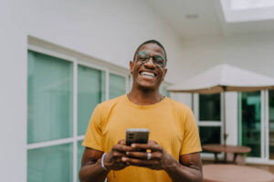 Smiling young man in the backyard